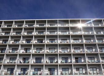 Portugal, Azores, Ponta Delgada, Rows of identical apartment building balconies - WWF05904