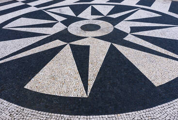 Compass rose painted on paved terrace - WWF05917