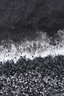 Splashing sea at coastline with pebbles at Rocha da Relva beach - WWF05934