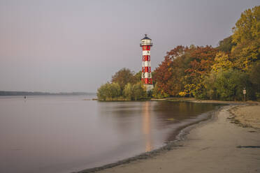 Germany, Hamburg, Wittenbergen Lighthouse standing on bank of Elbe in autumn - KEBF02098