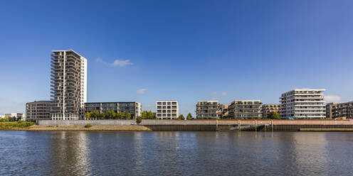 Germany, Bremen, Waterfront apartments along Weser river canal - WDF06710
