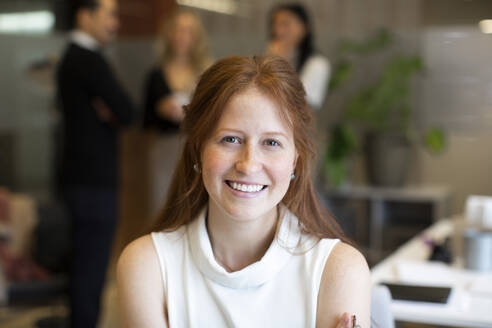 Portrait of smiling female entrepreneur in office - MASF27996