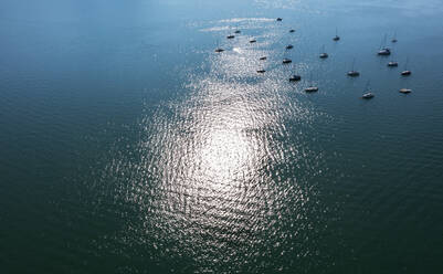 Drone view of sailboats floating in Mondsee lake - WWF05985