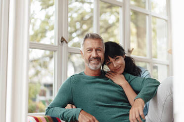 Woman leaning on man's shoulder at home - JOSEF06424