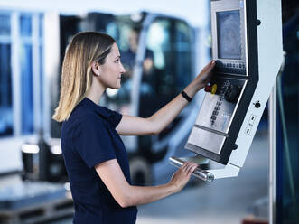 Engineer working on CNC machine in factory - CVF01791