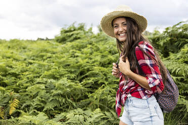 Smiling woman with hat and backpack at Cannock Chase - WPEF05663