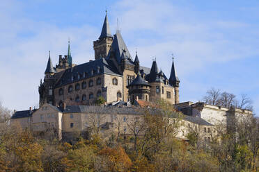 Germany, Saxony-Anhalt, Wernigerode, Exterior of Wernigerode Castle in autumn - WIF04484