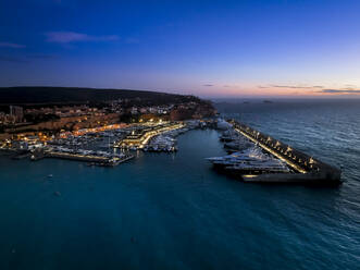 Boats moored at illuminated harbor, Port Adriano, Santa Ponca, Mallorca, Balearic Islands, Spain - AMF09369