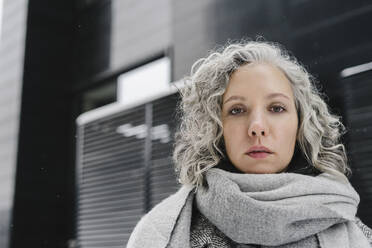 Woman with gray curly hair in winter - SEAF00356