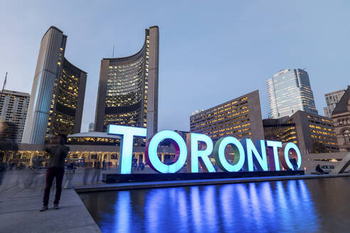 Canada, Ontario, Toronto, Long exposure of 3D Toronto Sign in Nathan Phillips Square at dusk - WPEF05712