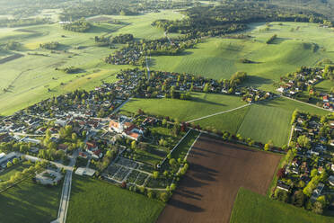 Germany, Bavaria, Berg, Aerial view of countryside village and surrounding fields and meadows in spring - WFF00554