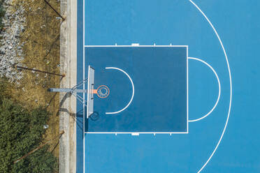 Aerial top view of a basketball field along the coast in Korcula, Croatia. - AAEF13849