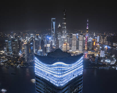 Aerial view of Lujiazui area in Shanghai at night with city skyline in background, China. - AAEF13922
