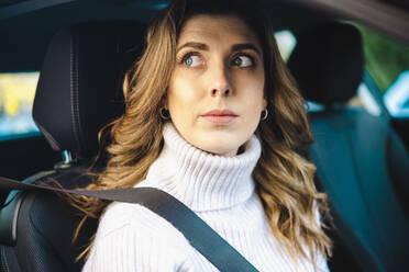 Contemplative woman in car - AMWF00082