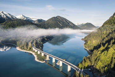 Sylvenstein Dam and bridge surrounded by morning mist in winter, Sylvensteinsee, Lenggries, Bavaria, Germany - WFF00583