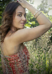 Smiling woman in summer forest - JBYF00097