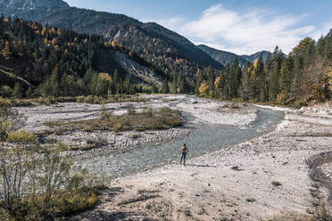 Man standing by river Rissbach, Hinterriss, Tirol, Austria - WFF00654