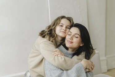 Daughter embracing mother at home - SEAF00450