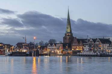 Germany, Schleswig-Holstein, Lubeck, Skyline of Travemunde at dusk - KEBF02224