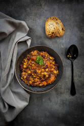 Studio shot of bowl of vegan quinoa stew with vegetables and chick-peas - LVF09194