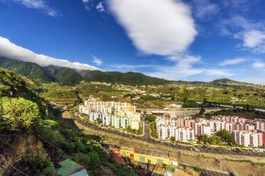 Townscape by mountains on sunny day at La Palma, Santa Cruz, Canary Islands, Spain - THAF03034