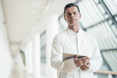 Confident scientist with tablet PC at office - JOSEF06963