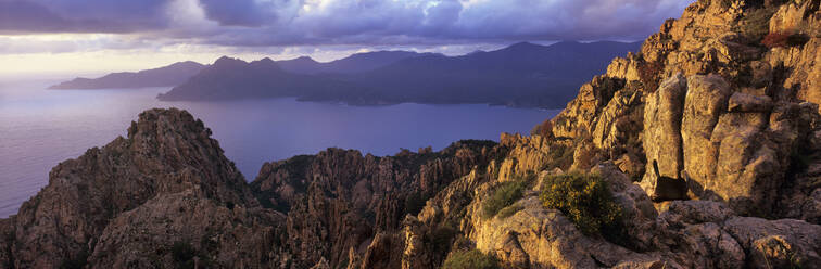 Calanques de Piana and view across the Gulf of Porto at sunset, Piana, Corsica, France, Mediterranean, Europe - RHPLF21171