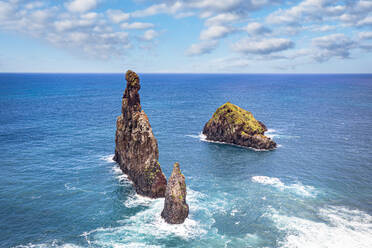 Aerial view of rock formation Ilheus da Rib and Ribeira da Janela in the rough ocean, Porto Moniz, Madeira island, Portugal, Atlantic, Europe - RHPLF21250