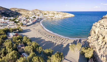 Sunrise over the empty beach of Matala seaside resort town, Crete, Greek Islands, Greece, Europe - RHPLF21660