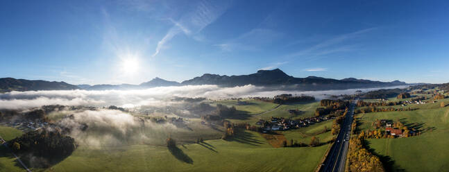 Austria, Upper Austria, Mondsee, Drone panorama of Salzkammergut at foggy autumn sunrise - WWF06074