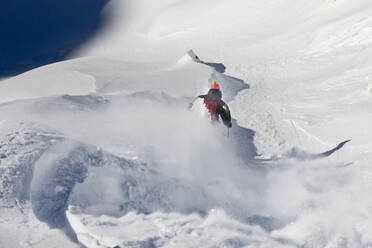 Young man skiing on snow covered mountain, Tyrol, Austria - CVF01920