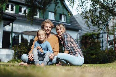 Smiling family with son in garden - JOSEF07129