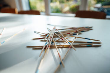 Mikado sticks on table at home - JOSEF07159