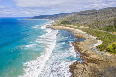 Australia, Victoria, Aerial view of rugged coastline along Great Ocean Road in summer - FOF12826