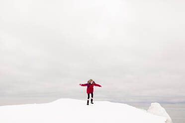 Girl with arms outstretched enjoying in winter - ANF00092