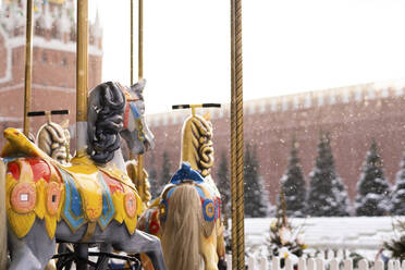 Carousel horses ride at Christmas market in winter - SSGF00507
