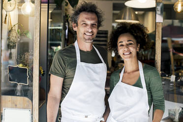 Portrait of male and female owners against bakery - MASF28783