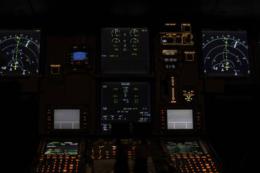 Illuminated speedometers on illuminated control panel in cockpit - PNAF03244