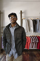 African American man standing in clothing store - TETF00015