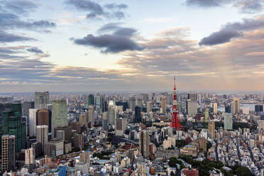 Japan, Kanto Region, Tokyo, Clouds over capital city downtown at dusk - FOF12870