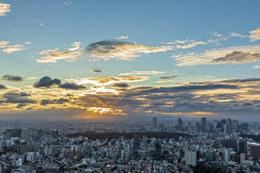 Japan, Kanto Region, Tokyo, Clouds over capital city downtown at sunset - FOF12871