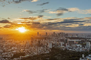Japan, Kanto Region, Tokyo, Clouds over capital city downtown at sunset - FOF12873