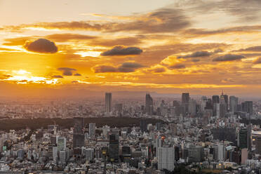 Japan, Kanto Region, Tokyo, Clouds over capital city downtown at moody sunset - FOF12874