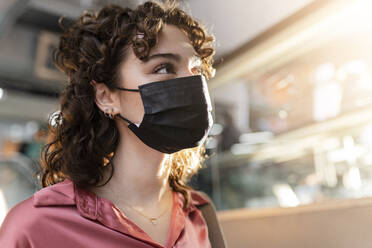 Young woman wearing protective face mask - JCCMF05385