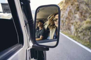 Reflection of couple on side-view mirror at road trip, Passo dello Stelvio, South Tyrol, Italy - SSCF00837