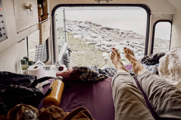Woman in camper van on vacation, Splugen Pass, Sondrio, Italy - SSCF00855