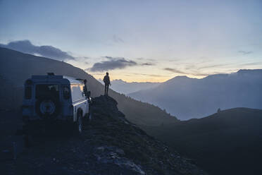 Silhouette of woman standing on rock at sunset, Colle dell'Assietta, Turin, Italy - SSCF00873