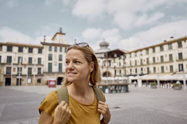 Smiling blond woman at town square - SSCF00932