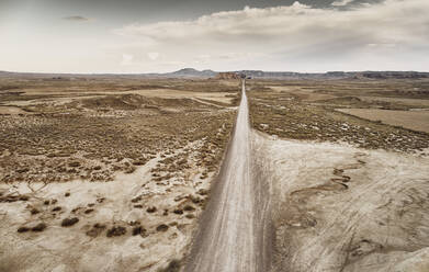 Dirt road passing through desert landscape at Bardenas Reales, Spain - SSCF00938
