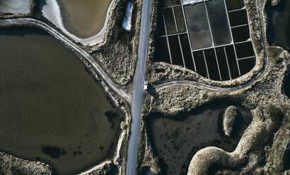 Road amidst salt flat on sunny day - SSCF01056